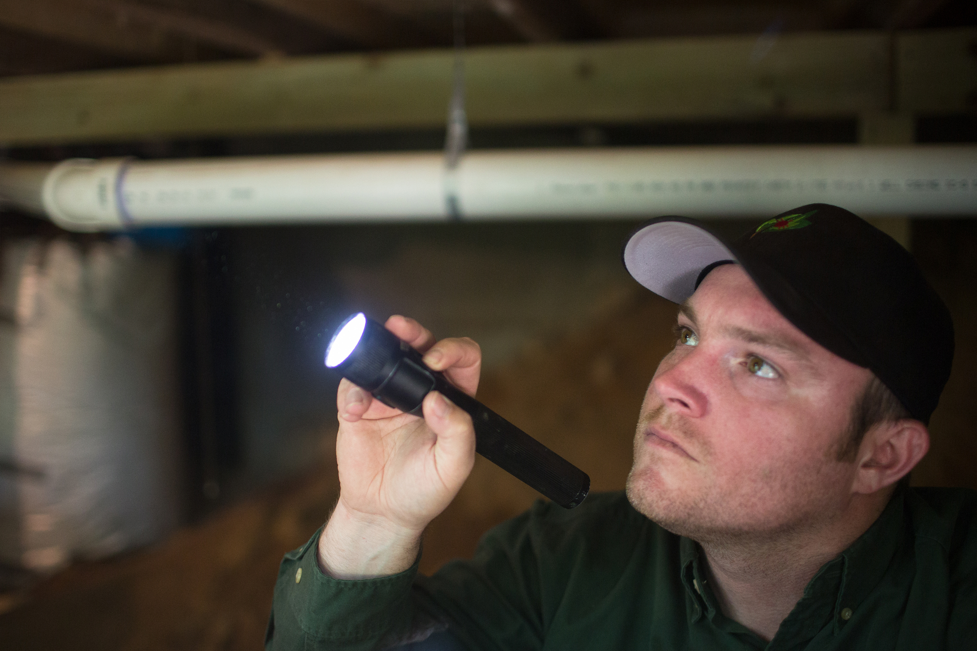 pest control technician inspection for termites in a crawl space